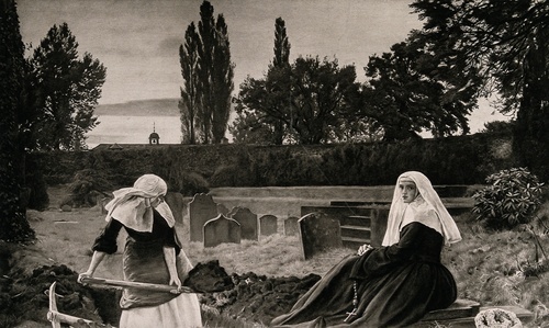 A young nun digging a grave while another nun looks on.