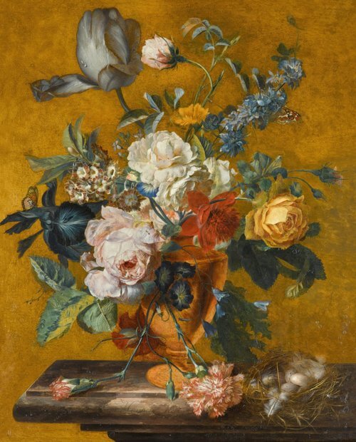 Still life of a tulip, roses, larkspur and other flowers in a vase on a marble ledge