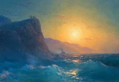 View of a Steep, Rocky Coast and a Rough Sea at Sunset