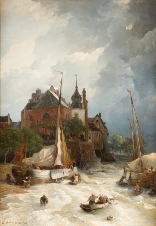 Beach by a town with old tower and rampart