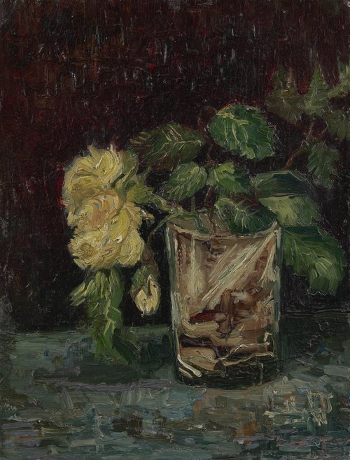 Glass cup with yellow rose