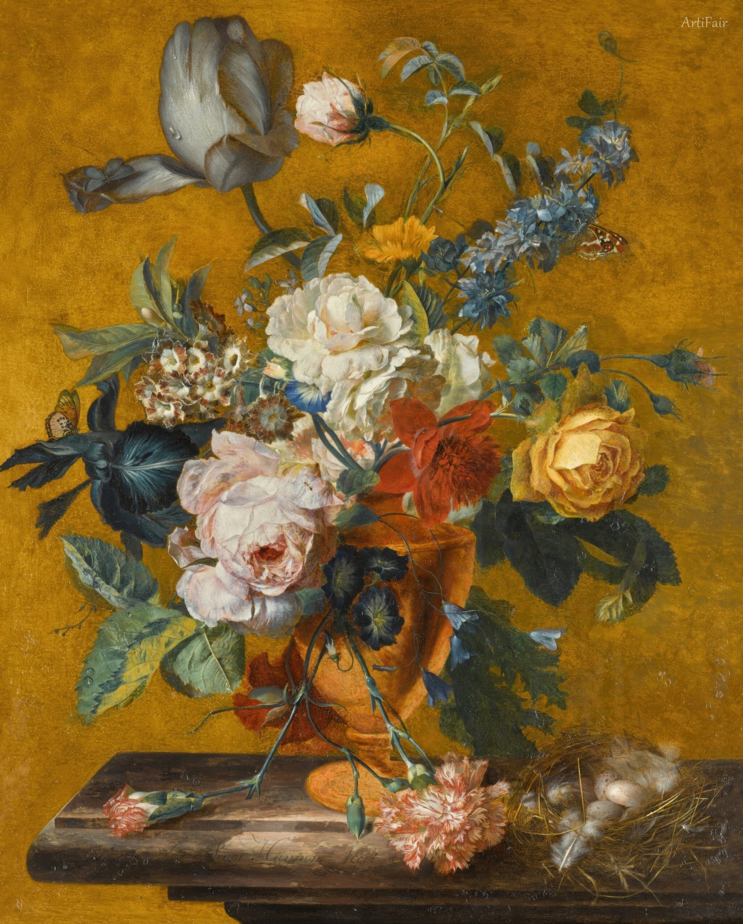 Still life of a tulip, roses, larkspur and other flowers in a vase on a marble ledge