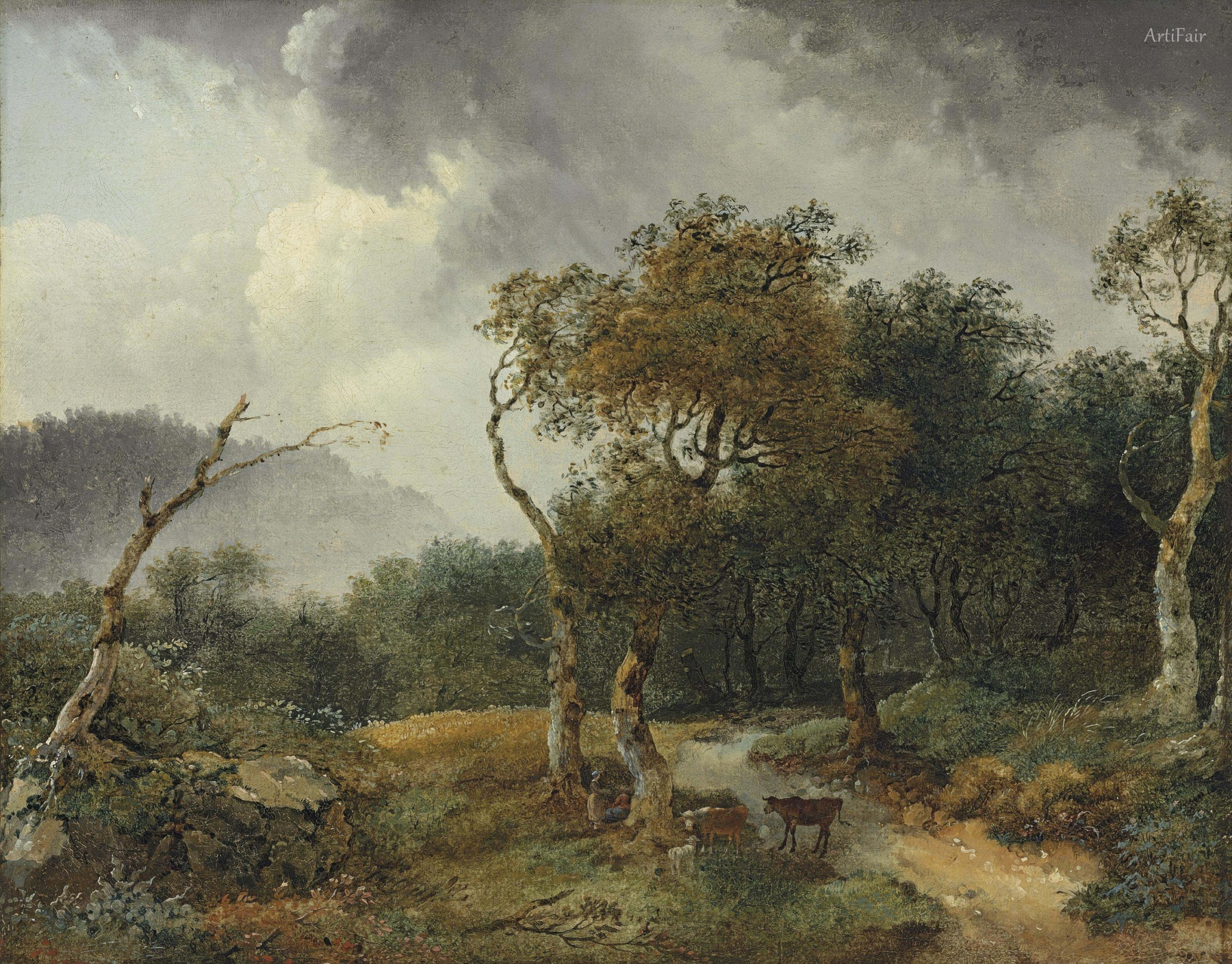 A wooded landscape with milkmaids and their cattle sheltering from a shower