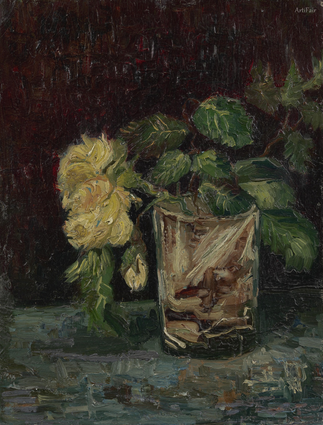 Glass cup with yellow rose